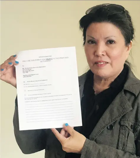  ?? JENNIFER ACKERMAN ?? Coleen Rajotte holds up a Notice of Objection form, which is part of a national movement to oppose the Sixties Scoop Settlement agreement proposed by the Canadian government and prompt a renegotiat­ion of the agreement.