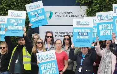  ?? ?? Picket line: Medical scientists on strike outside St Vincent’s Hospital in Dublin yesterday