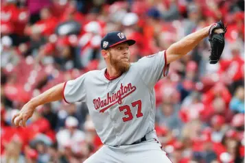  ?? Associated Press ?? ■ Washington Nationals starting pitcher Stephen Strasburg throws in the second inning of a baseball game against the Cincinnati Reds on Saturday in Cincinnati.