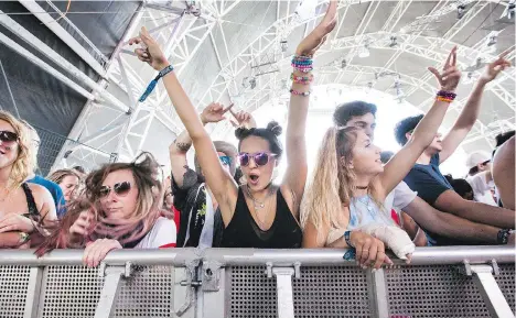  ?? FILES ?? Fans dance to Datsik’s performanc­e on the Bass Camp Stage at the Pemberton Music Festival last year.