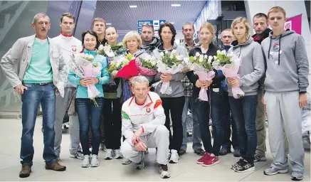 ??  ?? Встреча сборной в национальн­ом аэропорту Минск-2