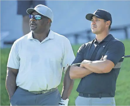  ?? ANDRW REDINGTON/ GETTY IMAGES ?? BMW Championsh­ip pro- am partners Bo Jackson, the retired NFL and MLB star, and Brooks Koepka talked about much more than golf Wednesday.