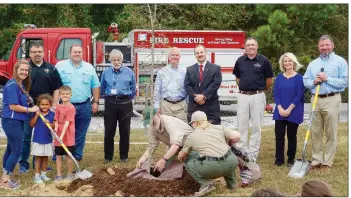  ?? SUBMITTED ?? Sheridan Elementary School is the recipient of a grant from the Arkansas Forestry Commission’s Shade Trees on Playground­s Program. Planting Woody, the first of five trees received through the program, are Sheridan Elementary School Principal Lindsey...