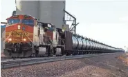  ?? MATTHEW BROWN/AP ?? A BNSF Railway train hauls crude oil near Wolf Point on Nov. 6, 2013.