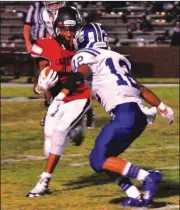  ?? FRANK CROWE / For the Calhoun Times ?? Gordon Central’s Alex Abat (12) prepares to bring down a Chattooga player last Friday.