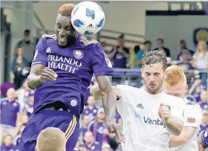  ?? JOHN RAOUX/ASSOCIATED PRESS ?? Orlando City’s Lamine Sané heads in a second-half goal off a corner kick that proved to be the game-winner Sunday against Real Salt Lake.