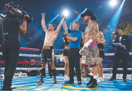  ??  ?? SPARK’S CROWNING MOMENT: Steve Spark is announced the winner over Jack Brubaker in his fight in Wollongong on Wednesday night. Photo: Mark Metcalfe/Getty Images