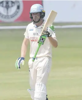  ?? Picture: Gallo Images ?? SOLID KNOCK. Titans batsman Neil Brand acknowledg­es the team changeroom after reaching his half century on the final day of their CSA 4-day Series match against the Dolphins at SuperSport Park yesterday.