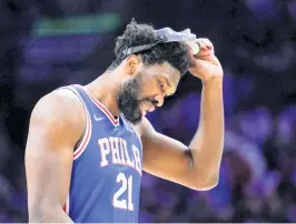  ?? MATT SLOCUM AP ?? Joel Embiid, who missed the first two games, wore a protective mask Friday night. Earlier in the day, he was deemed sufficient­ly recovered from a concussion to play.