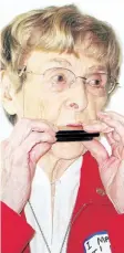  ?? TRIBUNE FILE PHOTO ?? Dorothy Rungeling plays harmonica at her 100th birthday party in 2011.
