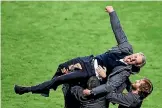  ?? PHOTO: REUTERS ?? Manchester United manager Jose Mourinho is raised in victory after his team won the Europa League.
