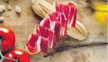  ?? ALFREDO PIOLA/ CINCO JOTAS ?? Jamon Iberico comes from black or dark-grey free-range pigs that feed on acorns in the last few months of their lives.