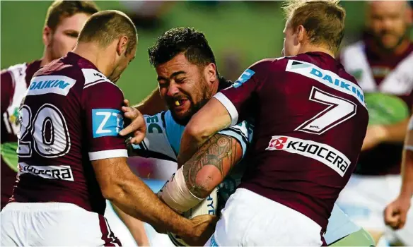 ?? PHOTO: MARK KOLBE/GETTY ?? GAME ON: Shark Andrew Fifita is tackled during the last meeting between his side and Manly in round three at Brookvale Oval.