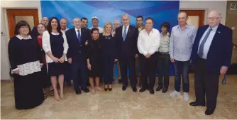  ?? (Haim Zach/GPO) ?? THE TORCH LIGHTERS meet with the prime minister and his wife last week in Jerusalem.