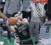  ?? MICHAEL DWYER — THE ASSOCIATED PRESS ?? The Celtics’ Jayson Tatum shoots the go-ahead basket against the Wizards’ Rui Hachimura on Sunday.