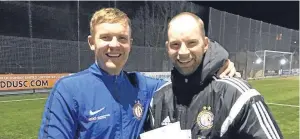  ??  ?? Stephen Mcnally, left, who has signed a two-year extension to his contract at Lochee United, with club secretary Marc Stanton.