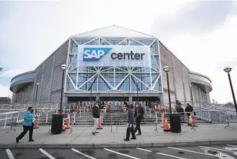  ?? Photos by Josie Lepe / Associated Press ?? Sharks staffers arrive at SAP Center for coronaviru­s tests. It was the team’s first home game of the season after playing their first 12 on the road due to Santa Clara County health restrictio­ns.