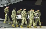  ?? STAFF SGT. AARON J. JENNE — U.S. AIR FORCE VIA AP ?? A U.S. Army carry team transfers the remains of Army Staff Sgt. Dustin Wright upon arrival at Dover Air Force Base, Del., late Thursday. Wright, 29, of Lyons, Ga., was one of four U.S. troops and four Niger forces killed in an ambush.