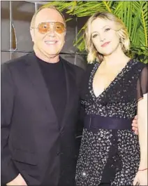  ?? Stefanie Keenan Getty Images ?? HOST Michael Kors pauses with goodwill ambassador Kate Hudson at a dinner benefiting the U.N. World Food Program.