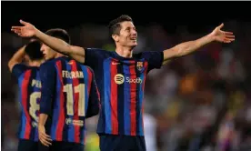  ?? Photograph: Pablo Morano/Reuters ?? Robert Lewandowsk­i celebrates scoring their fourth goal to complete his hat-trick in his first Champions League match for Barcelona.