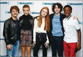  ?? ASTRID STAWIARZ / GETTY IMAGES FOR SIRIUSXM ?? Actors Gaten Matarazzo (from left), Millie Bobby Brown, Sadie Sink, Finn Wolfhard and Caleb McLaughlin, stars of Atlanta-filmed “Stranger Things,” are growing up in front of the camera — and that can make for a tricky childhood.