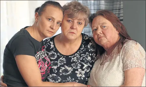  ??  ?? Ilona Adamczyk, left, pictured at home in Priesthill, with her mother Danuta Przybyla, middle, with friend and neighbour Sadie Masters, right