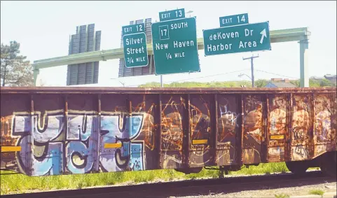 ?? Cassandra Day / Hearst Connecticu­t Media ?? The Genesee & Wyoming rail line that runs through Middletown passes by City Hall and the downtown area. Since the last administra­tion, officials have been trying to get the company to stop resting its cars for days at a time between downtown and Route 9.
