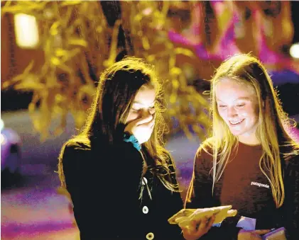  ?? STEPHEN M KATZ/STAFF ?? Cassidy Aiken, left, and Madison Booker get turned around during the Fort Monroe annual Ghost Walk.