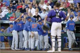  ?? MATT RYERSON — ASSOCIATED PRESS ?? The Florida dugout reacts after Jonathan India hit a two-run double in the fourth inning of Game 1 against LSU in Omaha, Neb., June 26. The game was not completed in time for this edition. For a full recap, go to MorningJou­rnal.com.