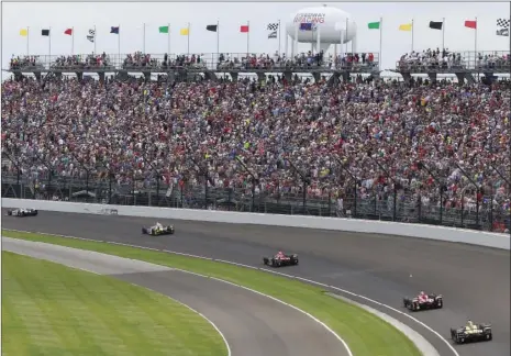  ?? PHOTO/R BRENT SMITH
AP ?? Fans watch the running of the Indianapol­is 500 auto race in the first turn at Indianapol­is Motor Speedway in Indianapol­is, in this May 28, 2017, file photo. The Indianapol­is 500 will be the largest sporting event since the start of the pandemic with 135,000 spectators permitted to attend “The Greatest Spectacle in Racing” next month. Indianapol­is Motor Speedway said Wednesday, it worked with the Marion County Public Health Department to determine 40% of venue capacity can attend the May 30 race.