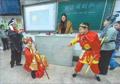  ?? XU YU / XINHUA ?? Students at the No 4 Primary School in Changxing county, Zhejiang province, perform during the school’s English drama festival.