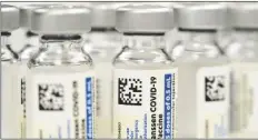  ?? DAVID ZALUBOWSKI/AP ?? Vials of the Johnson & Johnson COVID-19 vaccine are seen at a pharmacy in Denver on March 6, 2021.