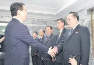  ?? REUTERS ?? Mr Cho shakes hands with Mr Ri before their meeting at the truce village of Panmunjom yesterday.