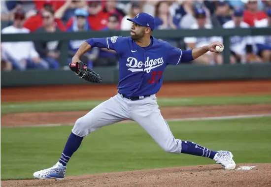  ?? AP fIlE ?? BIG ADDITION: Now a Dodger, David Price throws a pitch against the Reds during spring training in March.