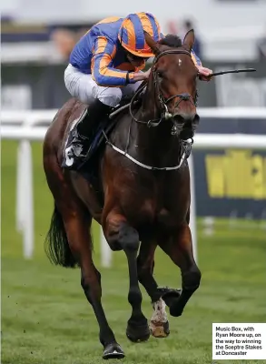  ??  ?? Music Box, with Ryan Moore up, on the way to winning the Sceptre Stakes at Doncaster