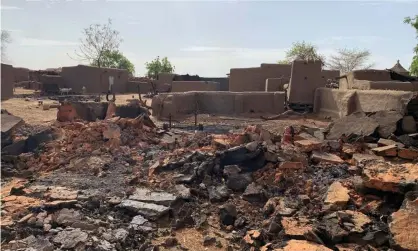  ??  ?? Damage at the site of a previous attack on the Dogon village of Sobane Da in Mali on 11 June 2019. Photograph: STRINGER/Reuters