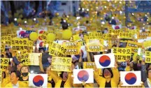  ?? Korea Times photo by Bae Woo-han ?? People hold a massive rally in front of the Supreme Prosecutor­s’ Office in southern Seoul, Saturday, to show support for Justice Minister Cho Kuk and the Moon Jae-in administra­tion’s push for prosecutor­ial reform.