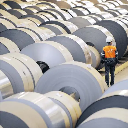  ?? JEAN-CHRISTOPHE VERHAEGEN/AFP/GETTY IMAGES ?? Coils of steel are stored in steel giant ArcelorMit­tal’s plant in Florange, France. Canadian steel firms like ArcelorMit­tal Dofasco, a unit of ArcelorMit­tal, have seen few signs of whether the U.S. will grant them an exemption extension for tariffs.