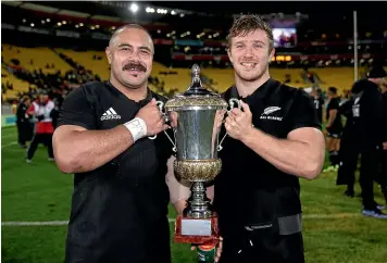  ?? GETTY IMAGES ?? Karl Tu’inukuafe, left, and Nathan Harris hold the Gallaher Trophy after the All Blacks beat France in Wellington last year. Now, both are expected to miss out on the World Cup.