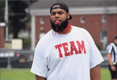  ?? Pete Paguaga / Hearst Connecticu­t Media ?? Cromwell/Portland coach Randell Bennett watches his team during a scrimmage at Pierson Park in Cromwell.