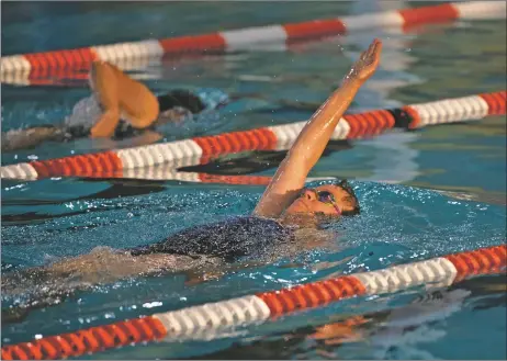  ?? MORGAN TIMMS/Taos News ?? Members of the Taos Masters Swim Program swim laps during morning practice Wednesday (Sept. 16) at the Taos Youth and Family Center. The Masters swimmers have been the only ones allowed in Taos’ only public community pool to prevent the spread of COVID-19. Below: Taos Masters swimmers swim in opposite directions to minimize interactio­n Wednesday (Sept. 16) at the Taos Youth and Family Center.