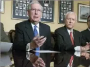  ?? J. SCOTT APPLEWHITE — THE ASSOCIATED PRESS ?? In this Nov. 9, photo, from left, Senate Majority Leader Mitch McConnell, R-Ky., Senate Finance Committee Chairman Orrin Hatch, R-Utah, and Treasury Secretary Steven Mnuchin, speak to reporters as work gets underway on the Senate’s version of the GOP...