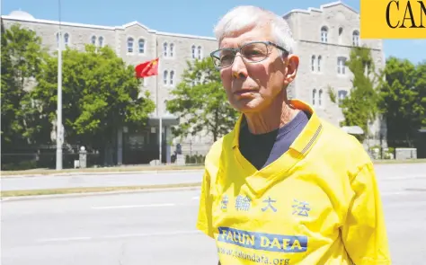  ?? JEAN LEVAC/POSTMEDIA NEWS ?? Gerry Smith, who was asked to remove his Falun Gong T-shirt at Ottawa’s Dragon Boat festival, stands in front of the Chinese Embassy Thursday.