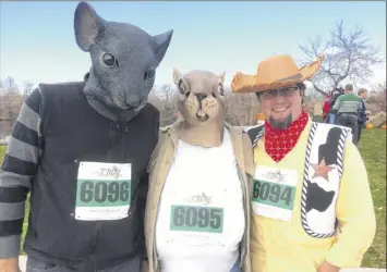  ?? Photo by Edward Parham ?? Can you top these costumes? Enter the Troy Turkey Trot contest on Thanksgivi­ng morning.