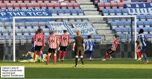  ??  ?? Callum Lang of Wigan scores their second goal against Sunderland