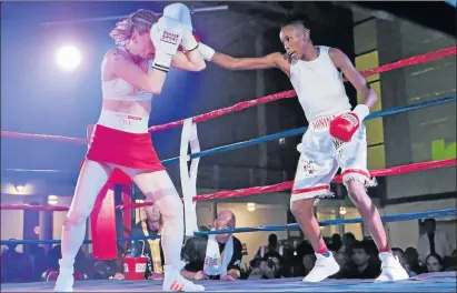  ?? Picture: MLONDOLOZI MBOLO ?? IN CONTROL: Bukiwe Nonina, right, throws a right to the head of German fighter Alesia Graf during their World Boxing Foundation (WBF) bantamweig­ht OR Tambo Hall, Khayelitsh­a, Cape Town over the weekend. Nonina emerged victorious