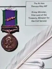  ??  ?? ‘Cowards’: The Northern Ireland medals, plus miniatures bought by veterans, with feathers and cards addressed to ministers