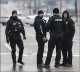  ?? PATRICK LANTRIP — DAILY MEMPHIAN VIA AP ?? Law enforcemen­t personnel work at the scene of a shooting at a library Thursday in Memphis, Tenn.