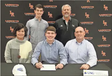  ?? Scott Herpst ?? Lafayette senior Riley Grant signed paperwork on Friday to continue his golf career at the University of North Georgia. Also on hand for the ceremony was Angie, Chip and Carter Grant and Lafayette head golf coach Tom Langford.