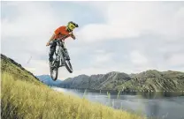  ?? PHOTO: SIMON WILLIAMS ?? Great outdoors . . . Simon Williams’ photograph of mountain biker Tristan Muirhead at Ironside Hill in Wanaka, which was published in Nikon’s photograph­y collection, I Am New Zealand: Aotearoa Through Many Eyes.